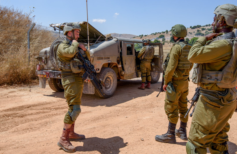  Israeli soldiers guard during Maintenance works on the border fence with Lebanon, near Avivim, June 13, 2023 (credit: AYAL MARGOLIN/FLASH90)