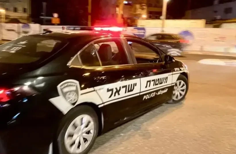  A police car at night (credit: AVSHALOM SASSONI)