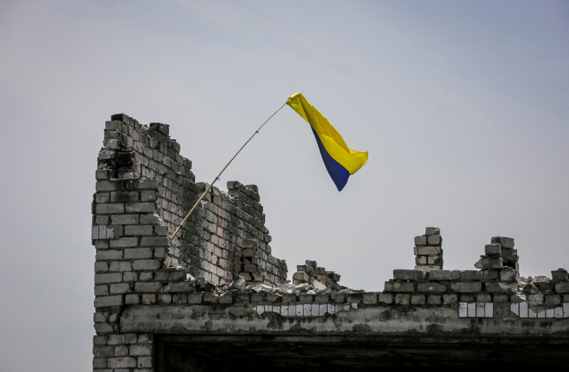  A Ukrainian national flag is seen, amid Russia's attack on Ukraine, near the front line in the newly liberated village Neskuchne in Donetsk region, Ukraine June 13, 2023. (credit: Oleksandr Ratushniak/Reuters)