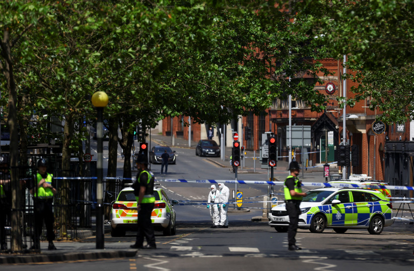 Police forensics officers work at a site cordoned with police tape, following a major incident in Nottingham city centre, Nottingham, Britain, June 13, 2023