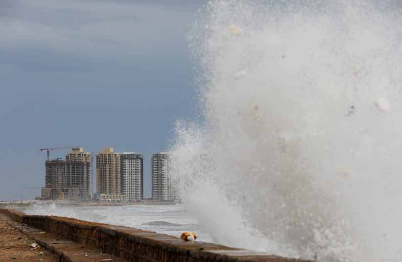  View of residential buildings as the rising waves splash, before the arrival of the cyclonic storm, Biparjoy, over the Arabian Sea, at Clifton Beach, in Karachi, Pakistan June 13, 2023. (credit: REUTERS/AKHTAR SOOMRO)