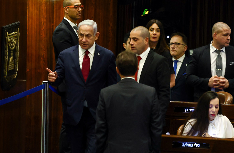  Prime Minister Benjamin Netanyahu gestures before he casts his vote as the Knesset elects its two members to the Judicial Selection Committee on June 14, 2023 (credit: RONEN ZVULUN/REUTERS)