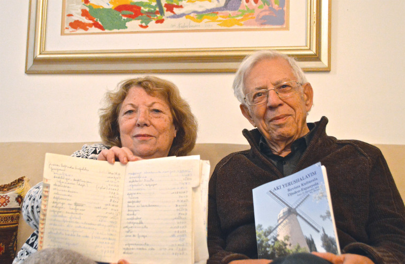  Moshe Shaul with Zelda Ovadia, associate editor of ‘Aki Yerushalayim,’ in Jerusalem in 2016. Shaul holds up the last issue of the magazine, while Ovadia holds up notes she took in Ladino while she worked as an editor for ‘La Bos de Israel.’ (credit: DANIEL SANTACRUZ)