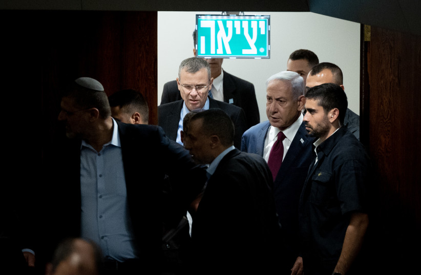 Israeli Prime Minister Benjamin Netanyahu and Justice Minister Yariv Levin arrive to a vote on the judge-picking panel at the assembly hall of the Israeli parliament in Jerusalem, June 14, 2023. (credit: YONATAN SINDEL/FLASH90)