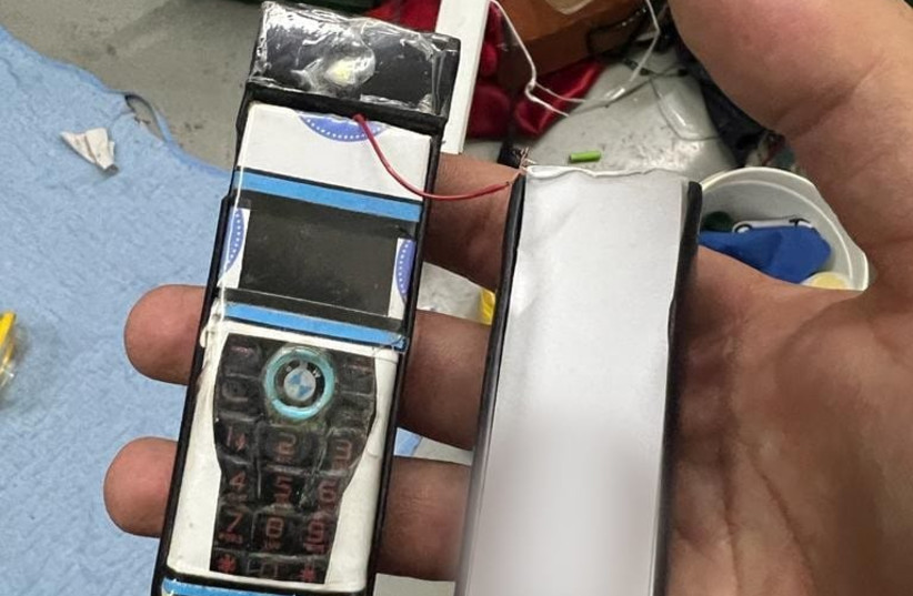  One of six smuggled mobile phones seized by the Israel Prison Service from prisoners from the Palestinian Islamic Jihad terrorist organization. (credit: ISRAEL PRISON SERVICE)