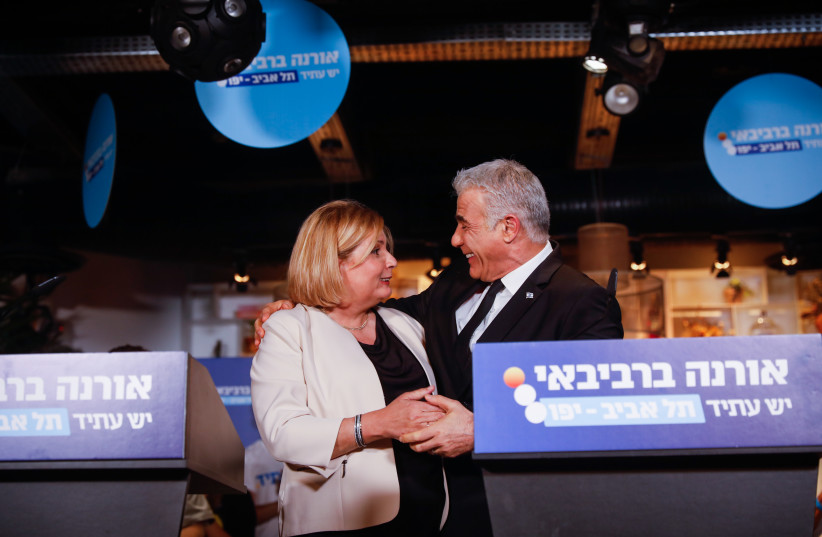  Yesh Atid MKs Orna Barbivay and Yair Lapid announce the former's run for mayor of Tel Aviv on June 21, 2023 (credit: MIRIAM ALSTER/FLASH90)