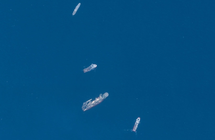 A satellite image shows ships taking part in the search and rescue operations associated with the missing Titan submersible near the wreck of the Titanic, June 22, 2023. (credit: MAXAR TECHNOLOGY/HANDOUT VIA REUTERS)