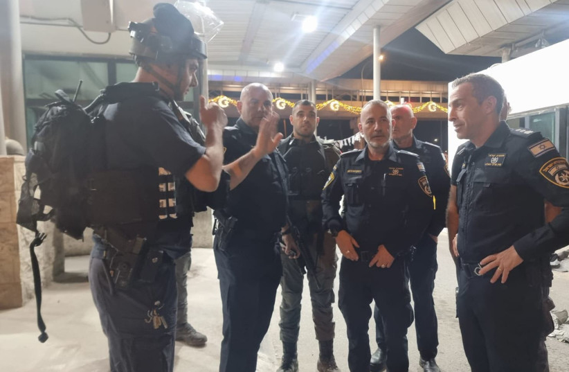  Police arrive at the scene where a security guard was slightly injured in a shooting incident with an attacker who walked on foot to the Kalandiya checkpoint from the West Bank, June 24, 2023. (credit: POLICE SPOKESPERSON'S UNIT)
