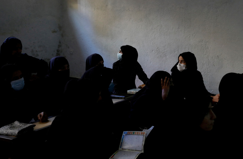   Afghan women learn how to read the Koran in a madrasa or religious school in Kabul, Afghanistan, October 8, 2022. (credit:  REUTERS/ALI KHARA)