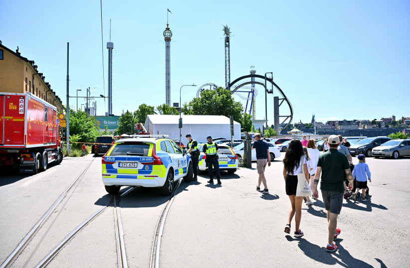  Police officers work at the scene after a roller coaster accident took place at an amusement park, according to the police, in Stockholm, Sweden, June 25, 2023.  (credit: Claudio Bresciani/TT News Agency/via REUTERS)