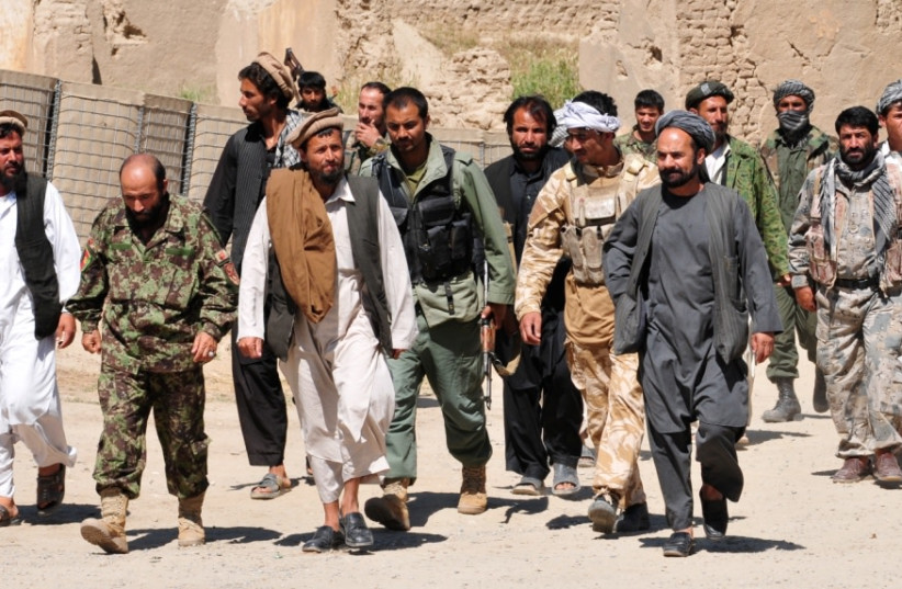  Taliban insurgents turn themselves in to Afghan National Security Forces, 2010 (credit: Wikimedia Commons)