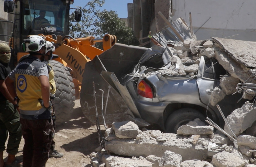 A general view of the aftermath of a Russian air strike at Jisr al-Shughour, Syria June 25, 2023 in this screen grab taken from a handout video (credit: WHITE HELMETS/HANDOUT VIA REUTERS)