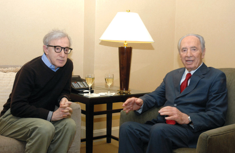  Woody Allen has a glass of wine with Shimon Peres, the president of Israel, in New York in 2008. (credit: Moshe Milner/GPO)