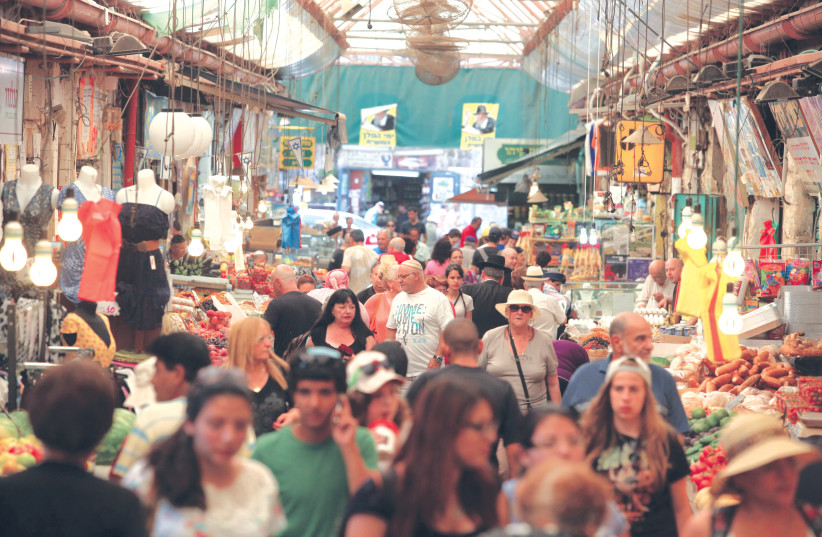  THE BUSTLING Mahaneh Yehuda market in Jerusalem turns 100.  (credit: Marc Israel Sellem/Jerusalem Post)