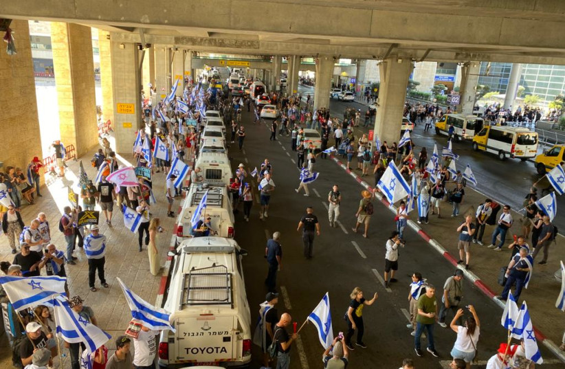  Israeli protesters seen outside Ben-Gurion Airport's Terminal 3 as part of demonstrations against the judicial reform on July 3, 2023 (credit: AVSHALOM SASSONI/MAARIV)