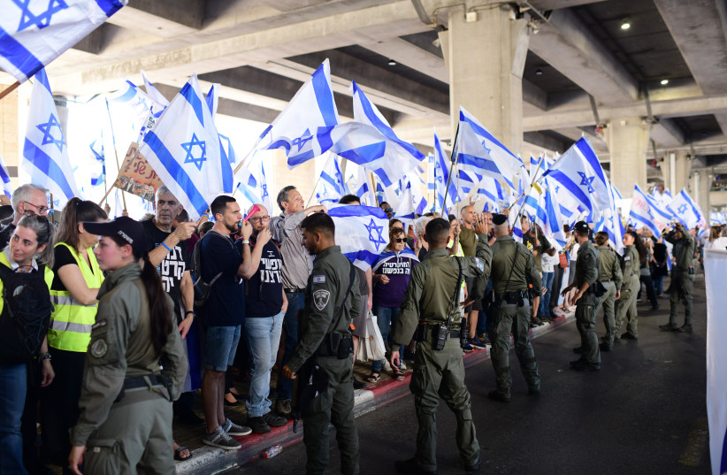 Israelis protest and clash with police during a protest against the Israeli government's planned judicial overhaul, at the Ben Gurion Airport near Tel Aviv, July 3, 2023 (credit: TOMER NEUBERG/FLASH90)