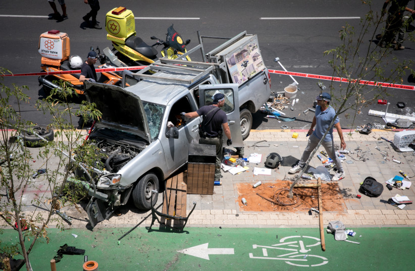  Police and rescue forces at the scene of a car ramming terror attack in north Tel Aviv on June 4, 2023. (credit: MIRIAM ALSTER/FLASH90)