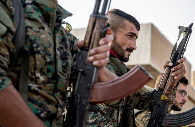 Syrian rebels with their rifles (credit: Wikimedia Commons)