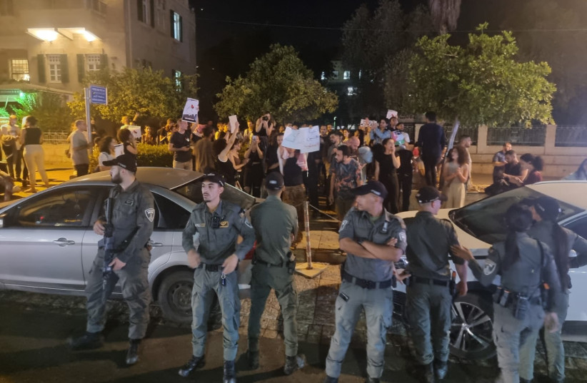  Police standing in front of protestors demonstrating in Haifa against the Jenin operations, July 4, 2023.  (credit: ISRAEL POLICE SPOKESMAN)