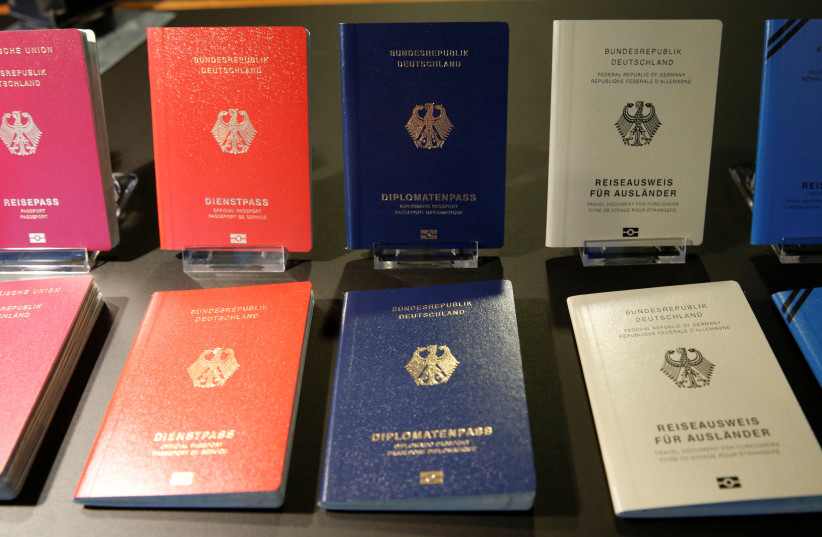 Specimens of the German new electronic passports are pictured during a presentation to the media in Berlin, Germany, February 23, 2017.  (credit: Fabrizio Bensch/Reuters)
