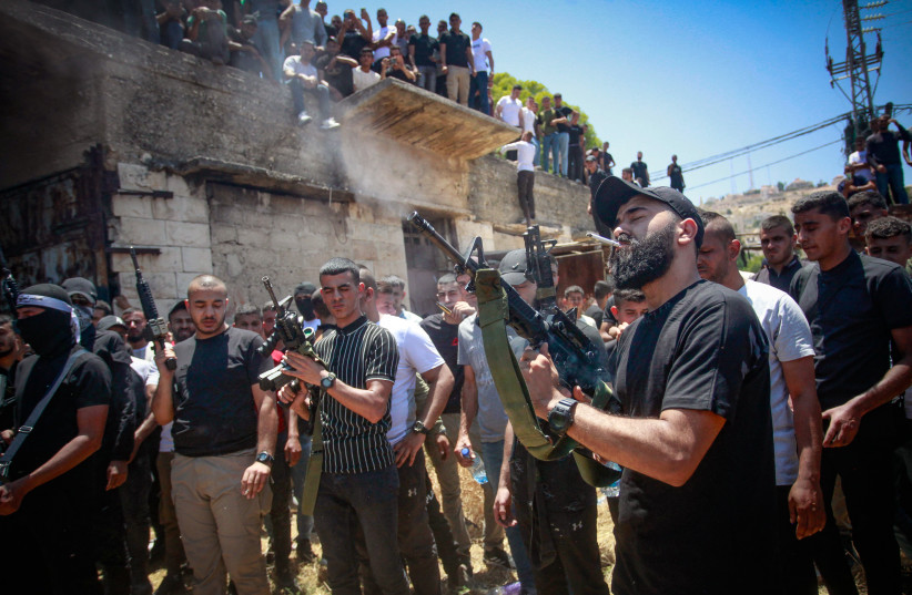  Palastinan gunmen and mourners attend the funeral of Palestinians who were killed during an Israeli military operation, in the West Bank city of Jenin, on July 5, 2023 (credit: NASSER ISHTAYEH/FLASH90)
