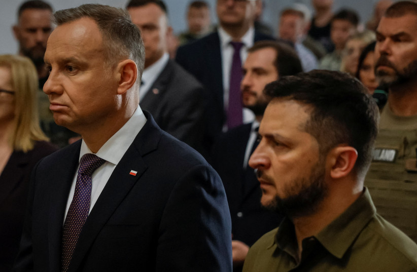  Ukraine's President Volodymyr Zelenskiy and Polish President Andrzej Duda commemorate victims of World War II at the Saint Peter and Paul Cathedral, amid Russia's attack on Ukraine, in Lutsk, Ukraine July 9, 2023 (credit: REUTERS)