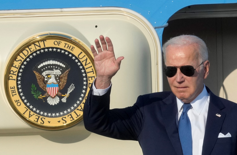  US President Joe Biden waves from the stairs of Air Force One as he arrives at Vilnius airport on the eve of a NATO leaders summit, Lithuania, July 10, 2023. (credit: Ints Kalnins/Reuters)