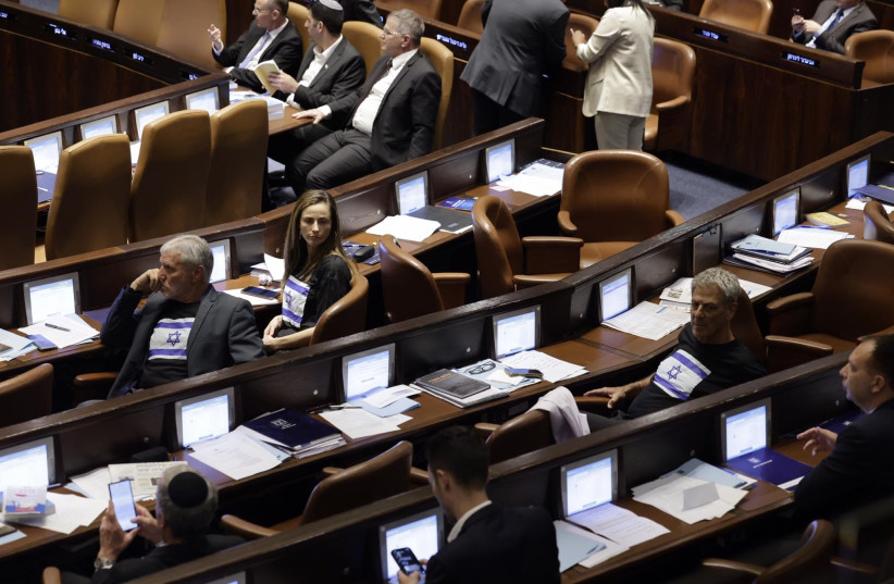  Opposition members wear Israel flag T-shirts to the debate. (credit: MARC ISRAEL SELLEM)