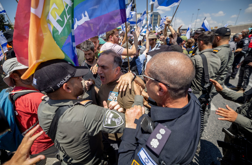  Police clash with anti-judicial overhaul demonstrators during a protest against the judicial overhaul in Jerusalem, July 11, 2023.  (credit: YONATAN SINDEL/FLASH90)