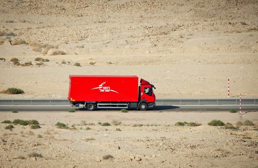  An Israeli post truck seen driving through the Israeli desert.  (credit: MOSHE SHAI/FLASH90)
