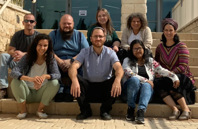  Prof. Evan Elliott (center) with members of his lab (credit: Azrieli Faculty of Medicine of Bar-Ilan University)