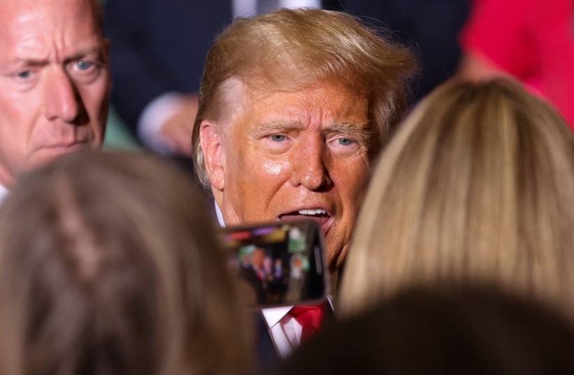  Former U.S. President and Republican presidential candidate Donald Trump speaks with people at a campaign event in Council Bluffs, Iowa, U.S., July 7, 2023. (credit: REUTERS/SCOTT MORGAN)