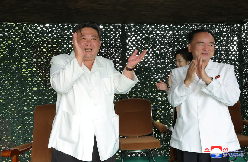North Korean leader Kim Jong Un reacts as Hwasong-18 intercontinental ballistic missile is launched from an undisclosed location in North Korea in this image released by North Korea's Korean Central News Agency on July 13, 2023. (credit: KNCA/REUTERS)