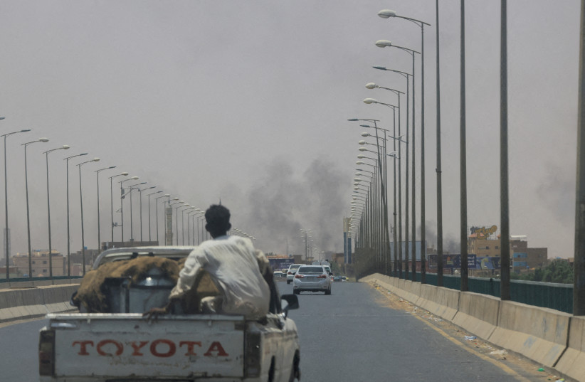  Smoke rises in Omdurman, near Halfaya Bridge, during clashes between the Paramilitary Rapid Support Forces and the army as seen from Khartoum North, Sudan April 15, 2023.  (credit: REUTERS/Mohamed Nureldin Abdallah/File Photo)