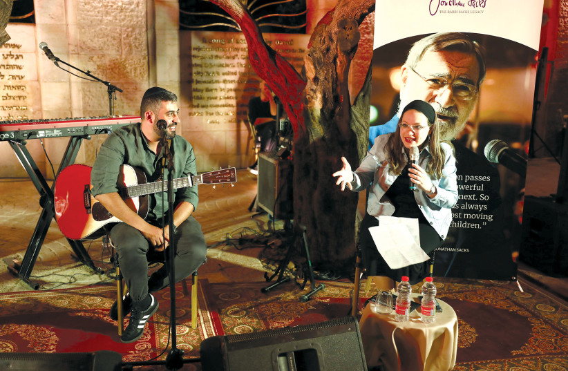  Israeli singer Ishay Ribo and journalist Sivan Rahav-Meir chat on stage. (credit: YONIT SCHILLER)