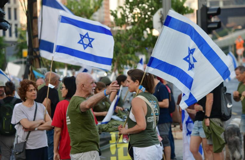  Two ''Brothers in Arms'' protestors at a protest in Tel Aviv, July 15. 2023. (credit: AVSHALOM SASSONI/MAARIV)