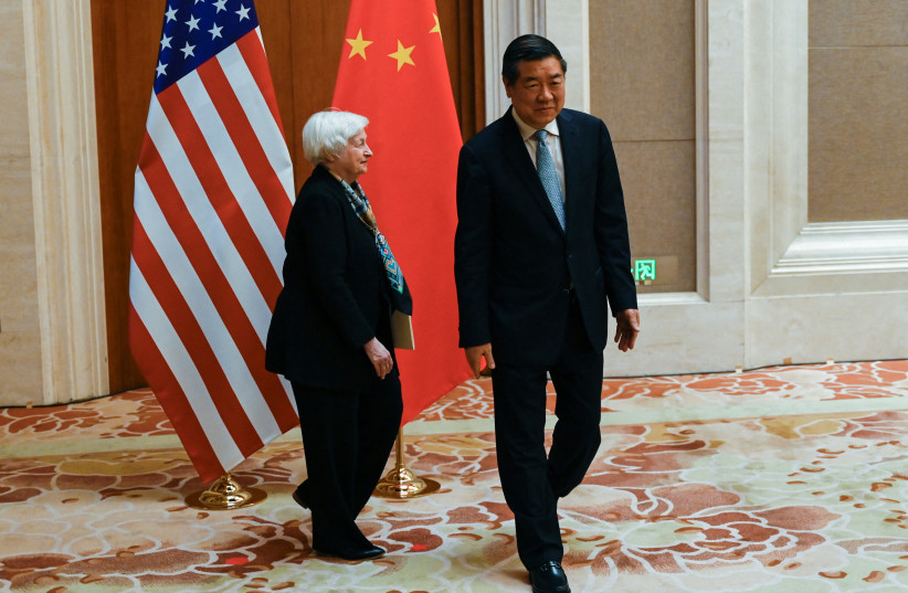  US Treasury Secretary Janet Yellen walks with China's Vice Premier He Lifeng during their meeting at the Diaoyutai State Guesthouse in Beijing on July 8, 2023. (credit: PEDRO PARDO/POOL VIA REUTERS)