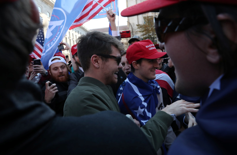  Supporters of the America First ideology and U.S. President Donald Trump cheer on Nick Fuentes, a leader of the America First movement and a white nationalist, as he makes his way through the crowd for a speech during the ''Stop the Steal'' and ''Million MAGA March'' protests after the 2020 U.S. presid (credit: REUTERS/LEAH MILLIS)