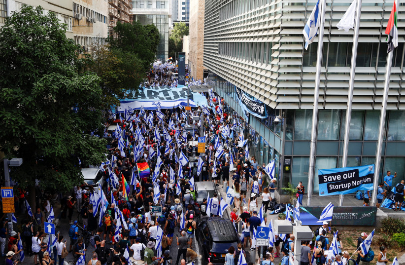  People demonstrate on the 'Day of National Resistance' in protest against Israeli Prime Minister Benjamin Netanyahu and his nationalist coalition government's judicial reform, in Tel Aviv, Israel July 18, 2023.  (credit: CORINNA KERN/REUTERS)