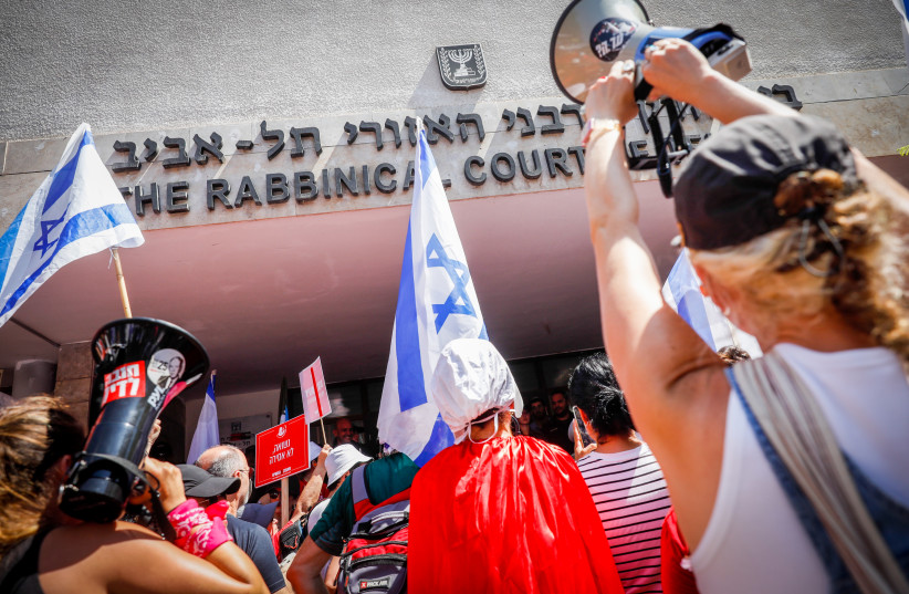  Israelis protest the government's judicial reform outside the Rabbinical Court of Tel Aviv, July 18, 2023.  (credit: MIRIAM ALSTER/FLASH90)