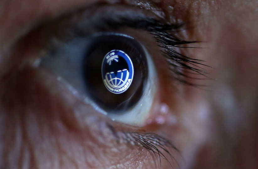  GRU, Russia's Main Intelligence Directorate logo is reflected in an eye in this picture illustration taken October 4, 2018.  (credit: DADO RUVIC/REUTERS)