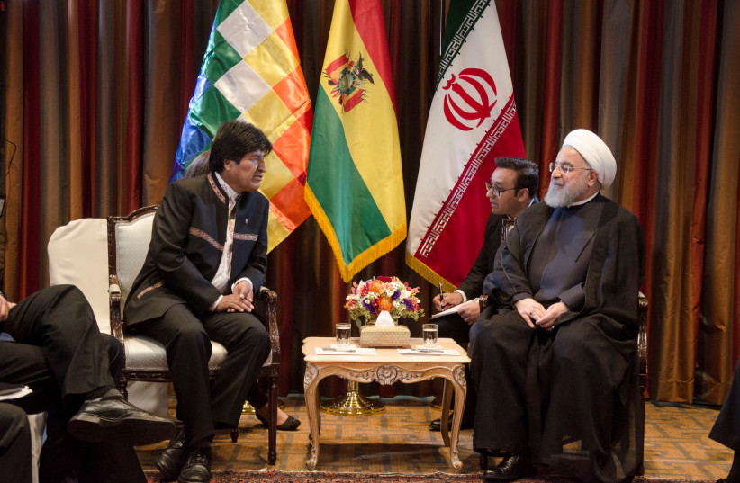 Bolivia's President Evo Morales talks with Iran President Hassan Rohani during a meeting in New York, U.S. September 24, 2018. P (credit: Hugo Aseff/Courtesy of Bolivian Presidency/Handout via REUTERS)