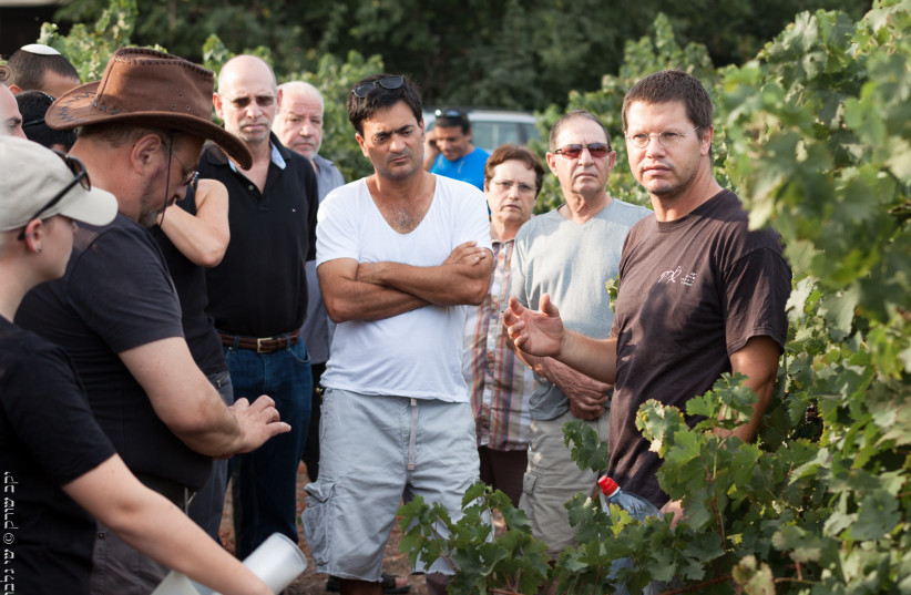 NIR SHAHAM (R) with students from the Soreq Winery Winemaking School.