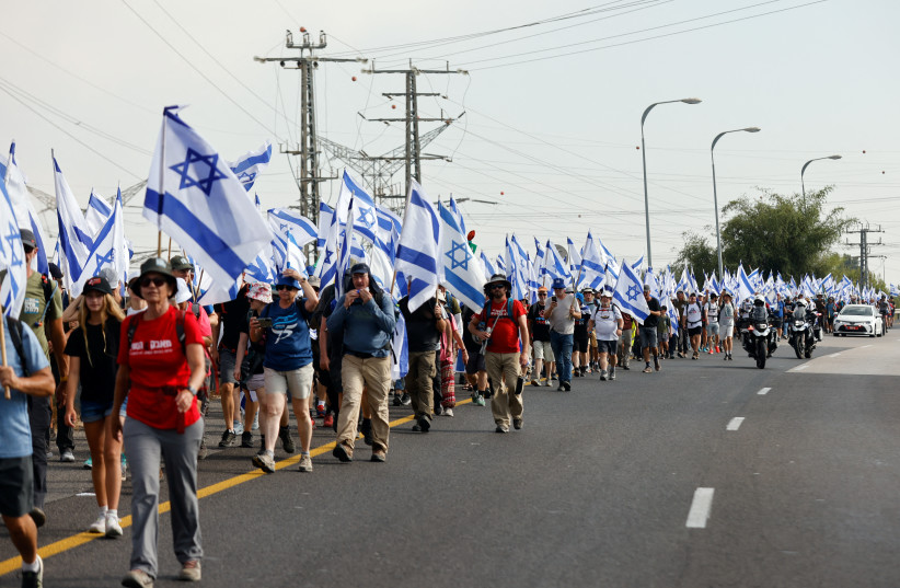 Demonstrators march from Tel Aviv to Jerusalem protesting against the Israeli government's judicial overhaul plans, near the Ben Shemen interchange, Israel July 20, 2023 (credit: AMIR COHEN/REUTERS)
