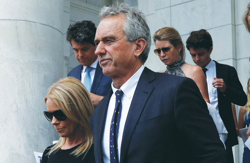  ROBERT F. KENNEDY JR. arrives with his wife, Cheryl Hines, at Arlington National Cemetery, in 2018, to mark the 50th anniversary of the death of his father, Robert F. Kennedy. (credit: LEAH MILLIS/REUTERS)