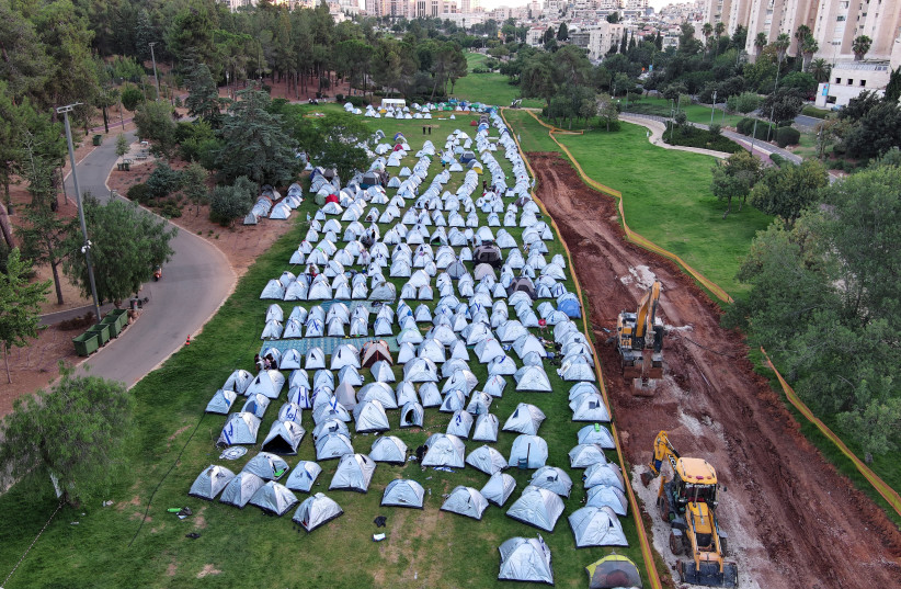  Protesters against the Israeli government's judicial overhaul plans gather in a camp they erected in Jerusalem July 23, 2023. (credit: REUTERS/ILAN ROSENBERG)
