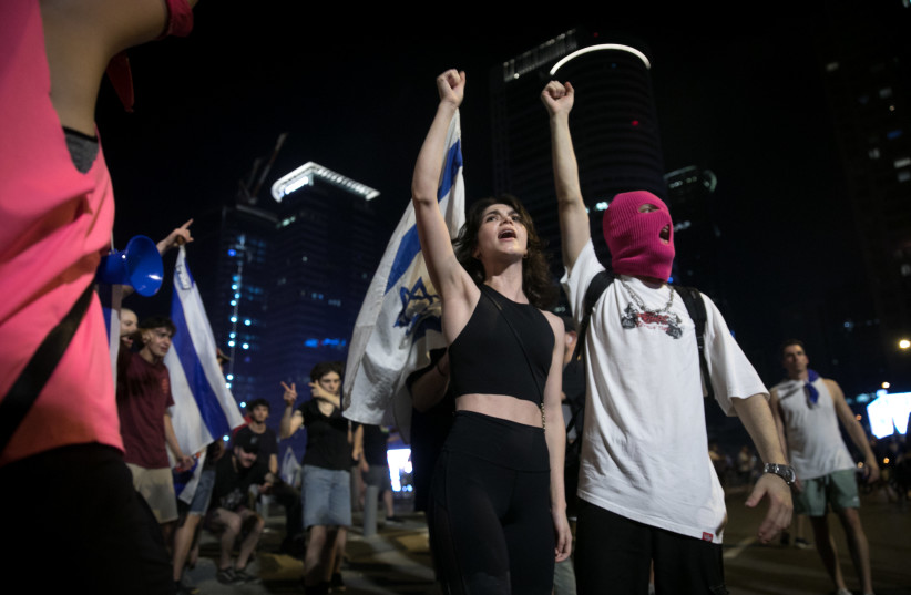  Anti-overhaul activists protest against the government's judicial overhaul in Tel Aviv, on July 22, 2023.  (credit: MIRIAM ALSTER/FLASH90)