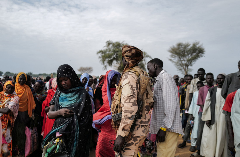  Sudanese refugees, who have fled the violence in their country, line up to receive food rations from World Food Programme (WFP), in Adre Chad July 20, 2023. (credit: REUTERS/ZOHRA BENSEMRA)