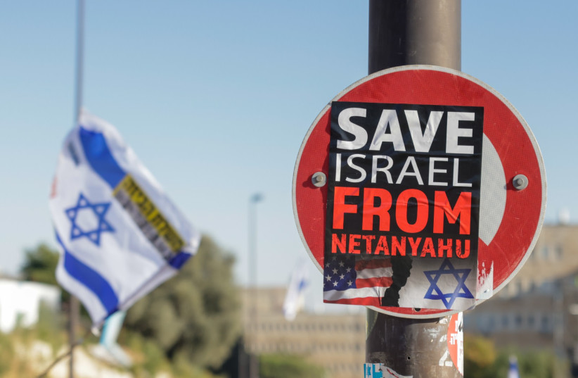  A sign reading ''Save Israel from Netanyahu'' is seen at a protest against the government's judicial reform, in Jerusalem, on July 23, 2023. (credit: MARC ISRAEL SELLEM/THE JERUSALEM POST)