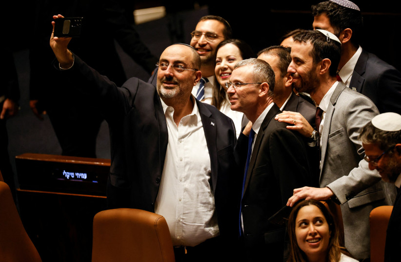  Israeli lawmakers take a selfie in the Knesset plenum following a vote on a bill that would limit some Supreme Court power, in Jerusalem July 24, 2023. (credit: AMIR COHEN/REUTERS)